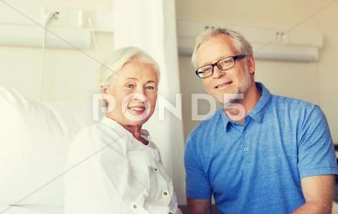 Senior couple meeting at hospital ward Stock Photos