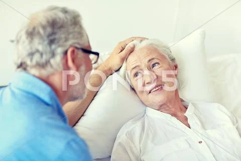 Senior couple meeting at hospital ward Stock Photos