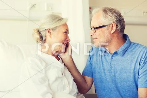 Senior couple meeting at hospital ward Stock Photos