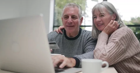 Senior couple online shopping Stock Footage