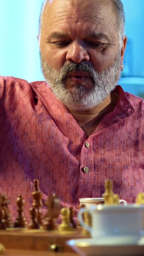 Senior couple playing chess board game at home for fun, bonding Stock Footage 343109592