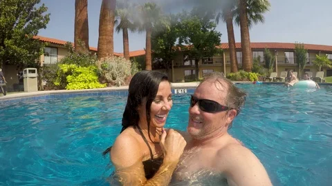 Senior couple in pool wave 스톡 동영상 94228602