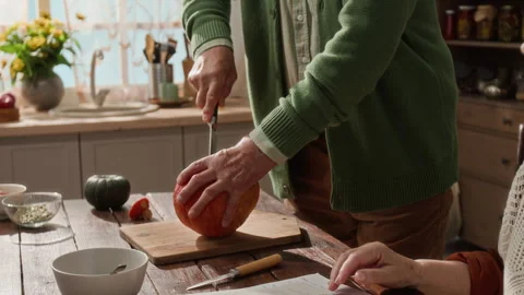 Senior Couple Preparing Pumpkin Pie Recipe for Thanksgiving Stock Footage 341394375