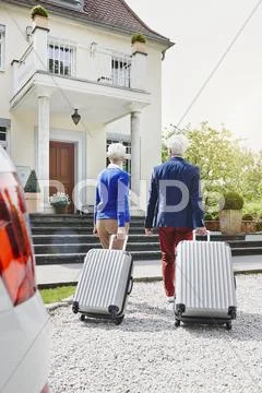 Senior Couple Preparing For Travel