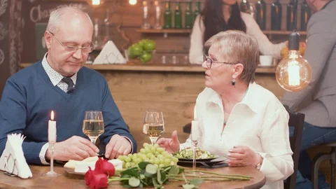 Senior couple on a romantic date having a conversation Stock Footage 106454418