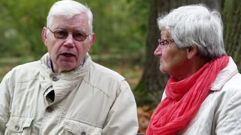 Senior couple sitting on a bench. Stock Footage 43083236