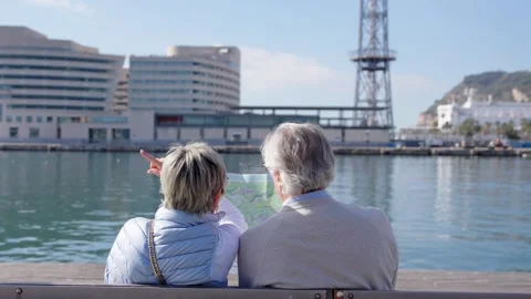 Senior couple sitting on a bench Stock Footage 272482842