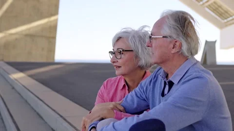 Senior couple sitting in a viewpoint talking and enjoying views Stock-Footage 262107965