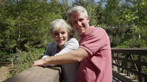 Senior couple smiling on bridge Video stock 49615421
