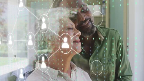 Senior couple standing at glass, node appearing, web forming over reflections, Stock Footage 332614324