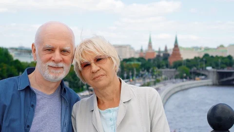 Senior couple standing on observation deck looking at camera. Pensioners Stock Footage 94623694