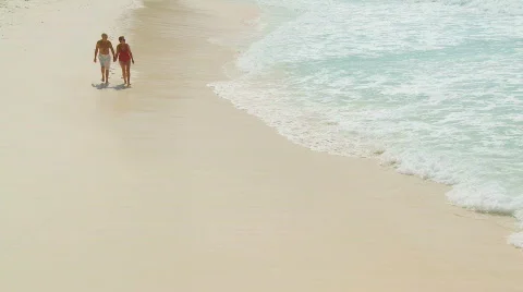 Senior couple strolling on beach part II Stock Footage