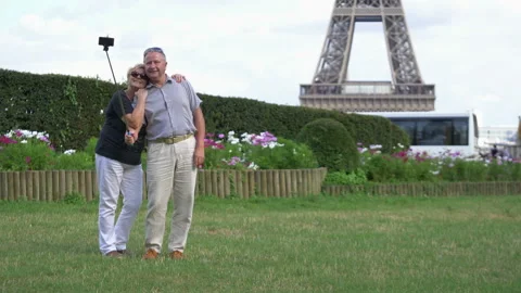 Senior couple taking selfie of Eiffel tower in Paris in 4k slow motion 60fps Stock Footage 122452839