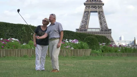 Senior couple taking selfie of Eiffel tower in Paris in 4k slow motion 60fps Stock Footage 122452962