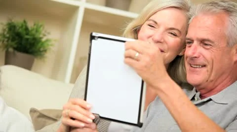 Senior Couple Talking Via Online Webchat Stock Footage 8963348