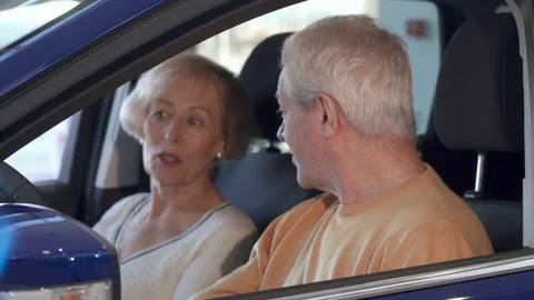 Senior couple talks inside the car Stock Footage 73735169