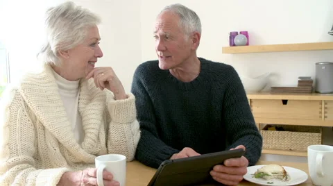 Senior Couple Using Digital Tablet At Home Stock Footage 43306249