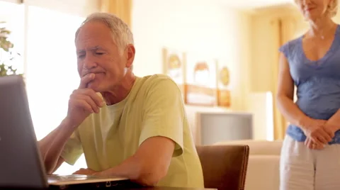 Senior couple using laptop computer Stock Footage 43622571