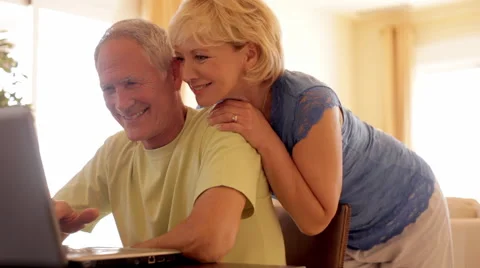 Senior couple using laptop computer Video stock 43622591