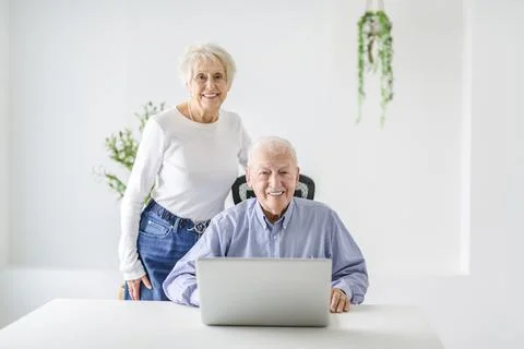 Senior couple using a laptop while sitting at the office 스톡 사진