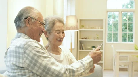 Senior Couple Using a Tablet PC Stock Footage 332771947