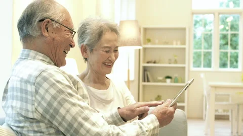 Senior Couple Using a Tablet PC Stock Footage 332771997