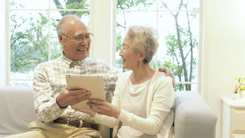 Senior Couple Using a Tablet PC Stock Footage 332772070
