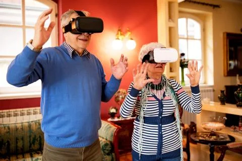 Senior couple using virtual reality headset Stock Photos