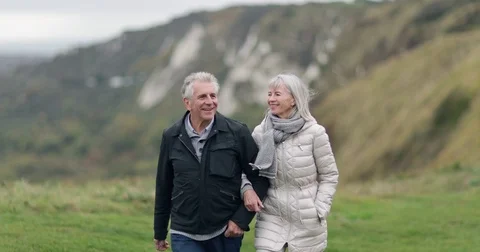 Senior couple walking outdoors Stock Footage