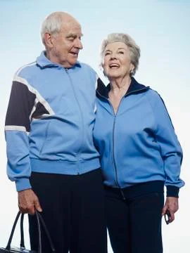 Senior couple wearing tracksuits ready for sport Stock Photos