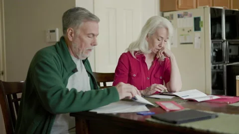 Senior couple worried about past due bills Stock Footage