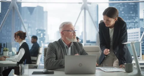 Senior Developer And Female Manager Working In Office Video stock 251643984