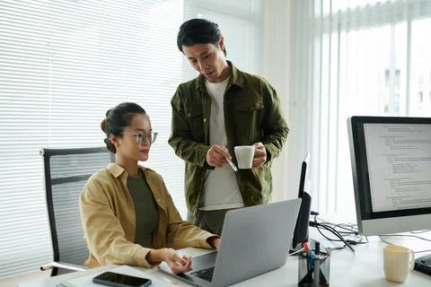 Senior Developer Helping Colleague Stock Photos