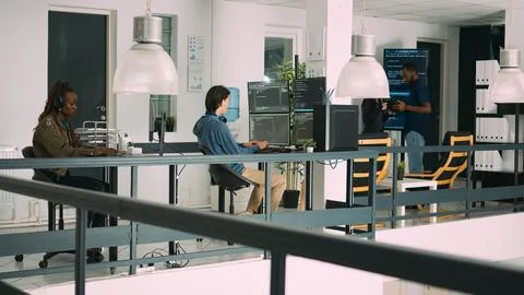 Senior developers coding on laptop in software agency office Stock Photos