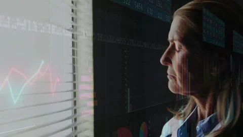 Senior doctor analyzing window-filtered health data, tapping tablet to update Stock Footage 311455064