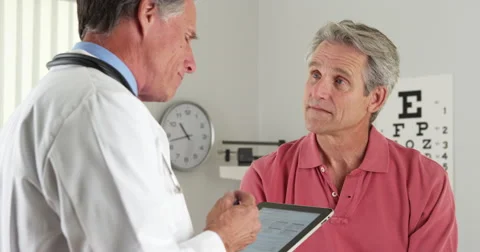 Senior doctor asking elderly patient questions Stock Footage
