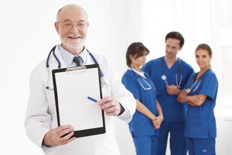 Senior doctor with blank folder Stock Photos