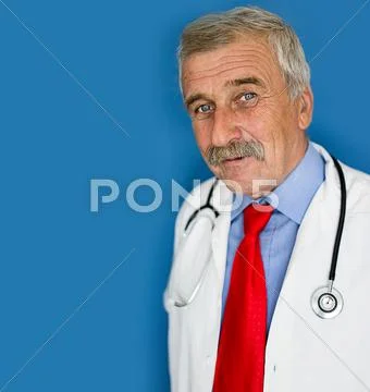 Senior Doctor On Blue Medical Background