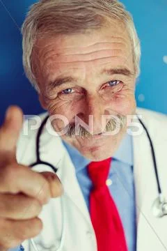 Senior Doctor On Blue Medical Background
