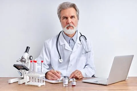 Senior doctor makes research, using tube tests in laboratory Stock Photos