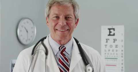 Senior doctor smiling at camera Video stock 58337652