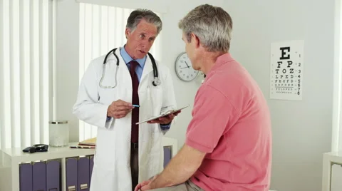Senior doctor talking with elderly patient Stock Footage