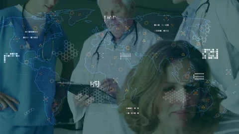 Senior doctor tapping tablet and starting animated world-map HUD, team Stock Footage 330893689