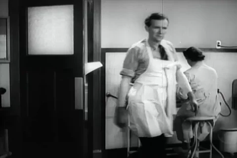 Senior doctors asks Dr. O'Donnell about the patient's medical condition - 1940 Stock Footage 98566246