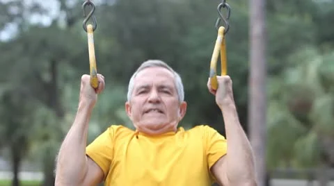 Senior doing pull-up on rings 스톡 동영상 20566868