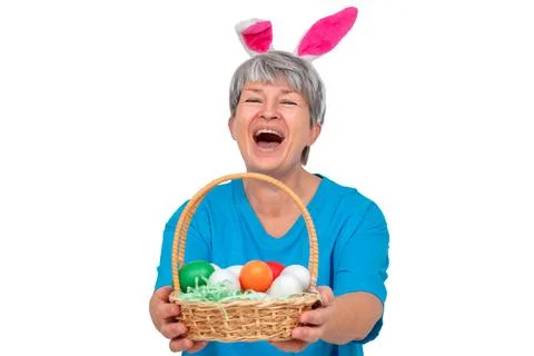 Senior with easter basket isolated Stock Photos