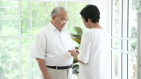 A senior elderly couple are hugging in home Stock Footage 137144404