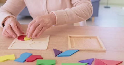 Senior elderly female engaged in logic game developing memory, thinking Stock Footage 321010930