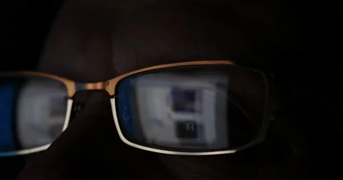 Senior elderly man in glasses surfing internet on tablet computer at night Stock Footage 58282998