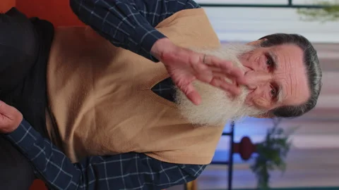 Senior elderly man presses finger to lips makes silence hush sign do not tells Stock Footage 219339735